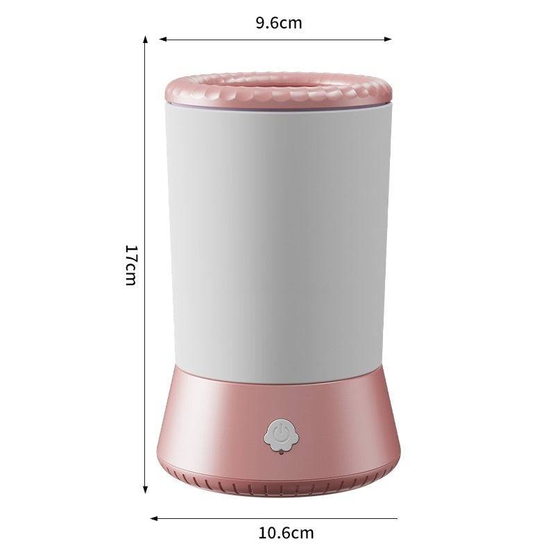 Compact electric pet paw cleaner with automatic washing function, designed for dogs and cats, portable grooming cup in pink and white.