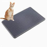 Gray cat litter box mat with honeycomb texture, designed to prevent tracking and repel litter spills for clean floors.