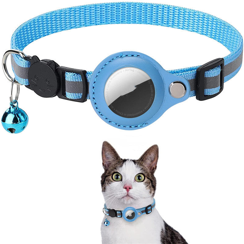 Adjustable blue reflective nylon pet collar with waterproof AirTag holder and bell, shown on a cat.