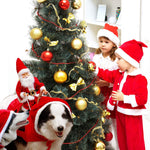 Load image into Gallery viewer, Two kids in Santa outfits decorate a Christmas tree while dogs wear Santa Claus reindeer costumes nearby

