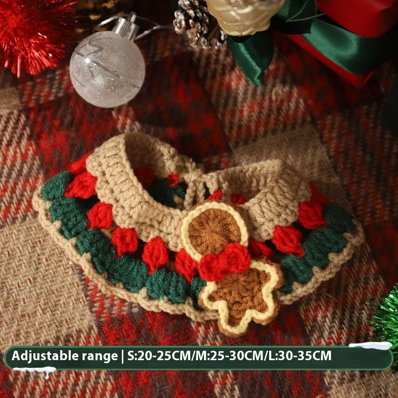Handmade Christmas pet scarf with red, green, and beige knit design and festive gingerbread decorations for cats and dogs.
