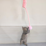 Load image into Gallery viewer, Kitten playing with pink rabbit fur ball teaser attached to a spring suction cat toy for exercise and fun
