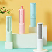 Colorful 2-in-1 Pet Hair Remover Brush in pastel shades displayed on blocks. Reusable and self-cleaning lint roller for cat and dog fur removal.