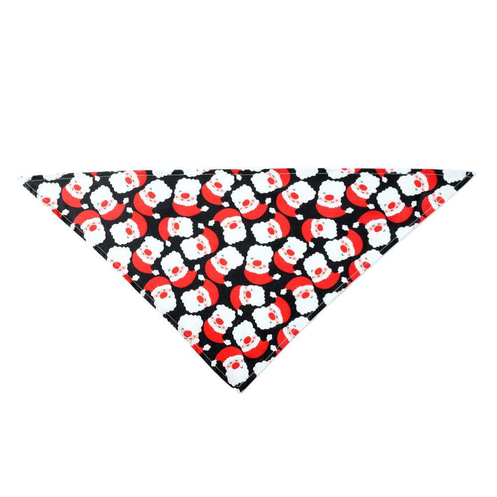 Triangle pet bandana with festive Santa Claus pattern, designed for dogs and cats for Christmas celebrations.