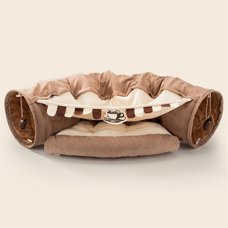 Collapsible cat tunnel with soft cushion, durable fabric, and interactive toys for playful and cozy pet entertainment.