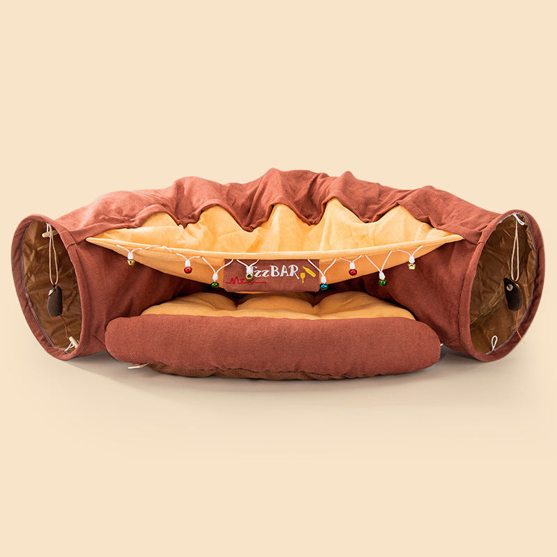 Collapsible cat tunnel with soft cushioned bed, interactive hanging toys, and washable durable fabric for playful pets.