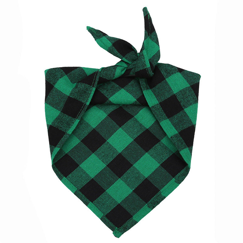 Green and black checkered triangular pet bandana scarf tied in a knot, festive accessory for dogs and cats.