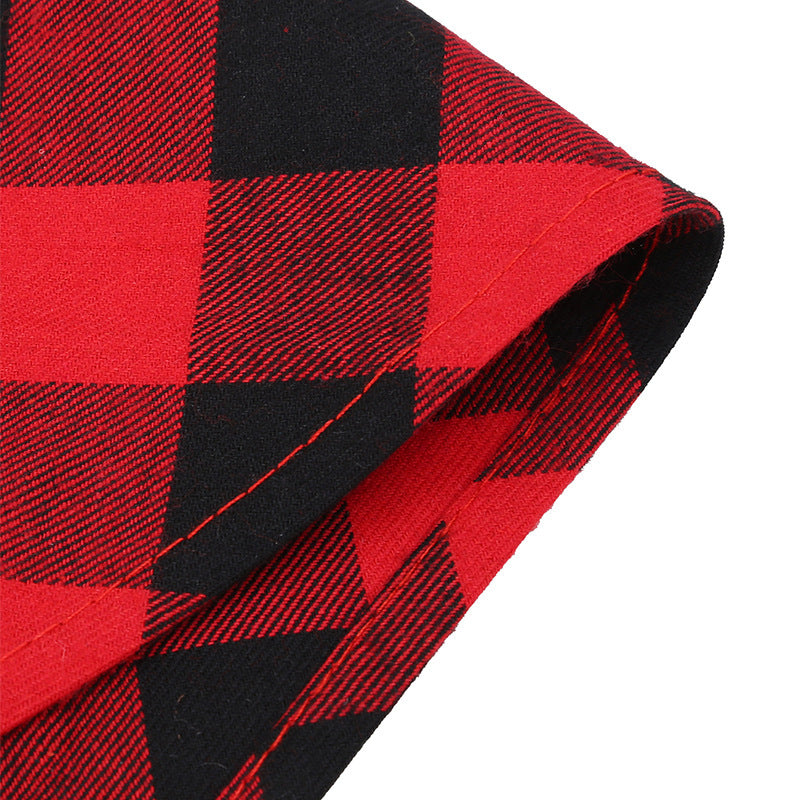 Close-up of red and black buffalo plaid triangular pet bandana for Christmas dog and cat scarf accessory