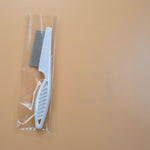 Load image into Gallery viewer, White pet grooming flea comb in clear plastic wrap, fine tooth stainless steel comb for flea and tangle control.
