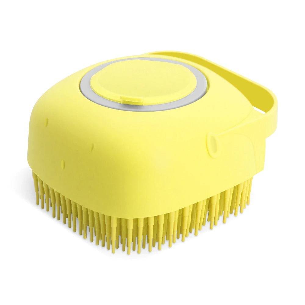 Yellow pet shampoo massager brush with soft silicone bristles and ergonomic handle for gentle grooming and bath time relaxation