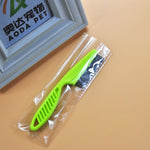 Load image into Gallery viewer, Green flea comb for pets in sealed plastic wrap, fine tooth stainless steel grooming tool for cats and dogs.