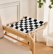 Space-saving cat hanging bed with black and white checkered pattern, perfect for window, balcony, or bedside perch.