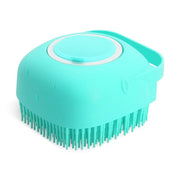 Turquoise pet shampoo massager brush with soft silicone bristles and ergonomic handle for gentle grooming and bath time relaxation.