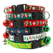 Stack of colorful Christmas bell dog and cat collars with festive holiday designs and jingling bells attached