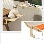 Load image into Gallery viewer, Two cats resting on space-saving wooden cat hanging beds attached to a window and balcony railing for cozy perch spots.
