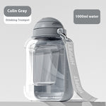 Load image into Gallery viewer, Gray 2-in-1 dog water bottle with integrated bowl and carry strap, large 1000ml capacity portable pet dispenser.
