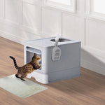 Load image into Gallery viewer, Grey enclosed cat litter box with slide-out tray and top-exit design shown with a cat entering from front opening
