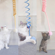 Cats playing with spring suction cup toys featuring colorful rabbit fur balls for interactive exercise and fun
