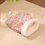 Load image into Gallery viewer, Cozy pink flannel cat sleeping bag nest with soft white fleece lining and playful animal print design on beige carpet.
