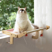 Fluffy cat resting on a wooden hanging bed mounted on a window, perfect for cozy and space-saving cat perch.