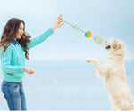 Load image into Gallery viewer, Woman playing with dog using a dog training chew ball with draw rope tug toy for teeth cleaning outdoors
