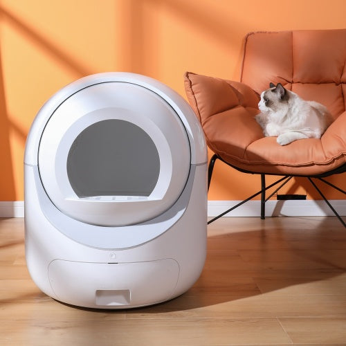 Smart automatic cat litter box with app control and self-cleaning 10L drawer next to a cat on an orange chair