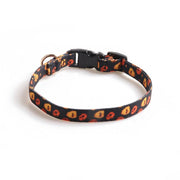 Adjustable Halloween pet collar with orange and yellow pumpkin and ghost pattern, featuring a black plastic buckle and metal ring.