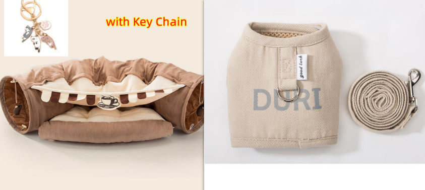 Beige collapsible cat tunnel with washable fabric, interactive design, and included leash and key chain accessory.