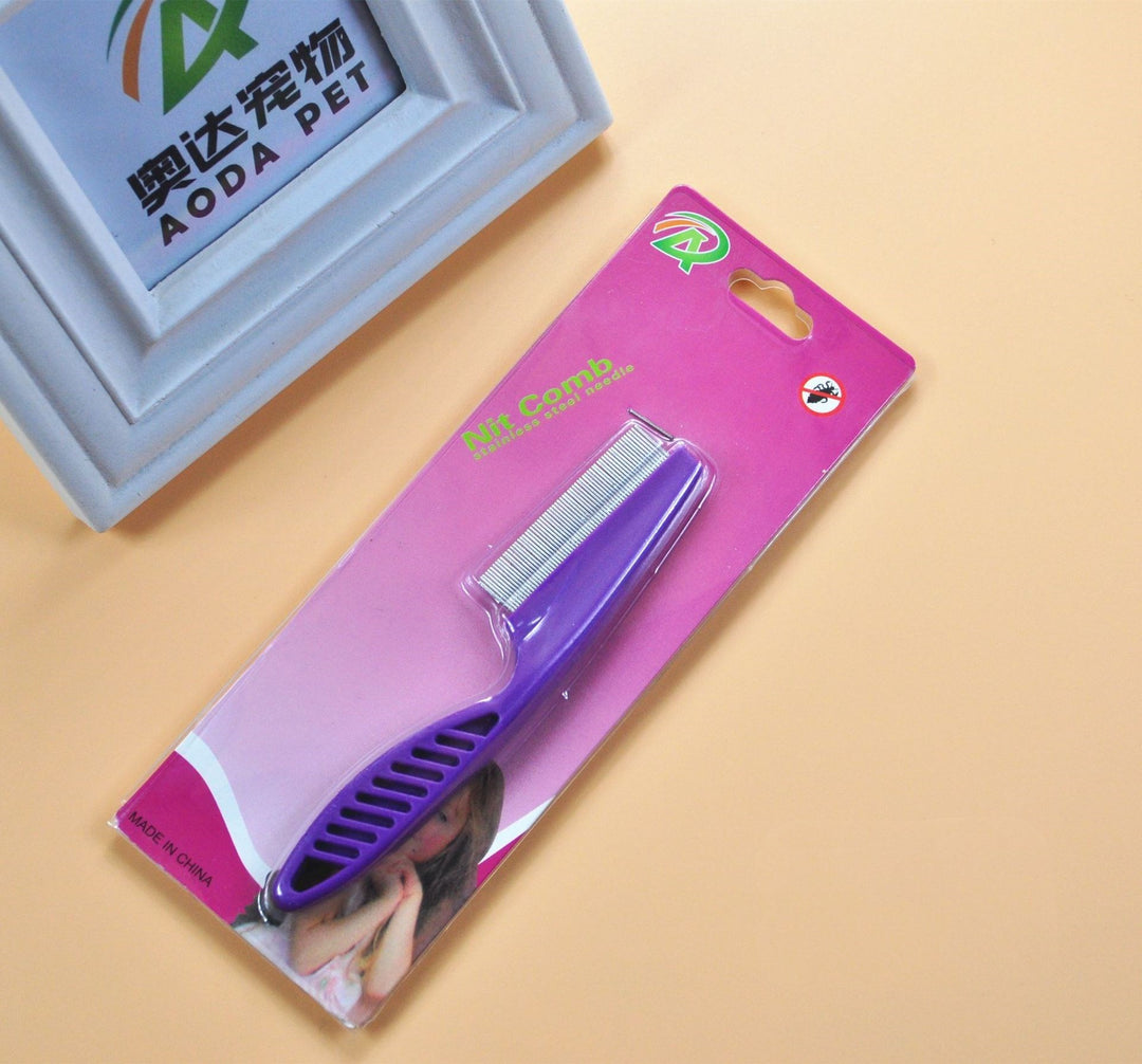 Purple anti-flea pet grooming comb in retail packaging, stainless steel teeth for effective flea removal in dogs and cats.