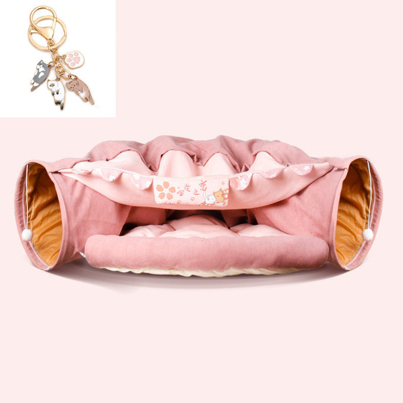 Pink collapsible cat tunnel with soft washable fabric and cushioned interior for interactive pet play and comfort