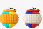 Load image into Gallery viewer, Two colorful dog training chew balls with textured surfaces and attached black draw ropes for tugging and teeth cleaning.
