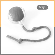 Grey interactive cat toy ball with attached string for feline play and exercise on a white background