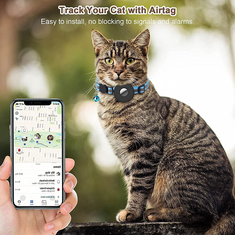 Tabby cat wearing a blue reflective adjustable Airtag pet collar with bell next to a hand holding a phone tracking the cat's location.