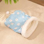 Blue flannel cat sleeping bag with white sheep pattern and soft plush lining for cozy pet comfort.