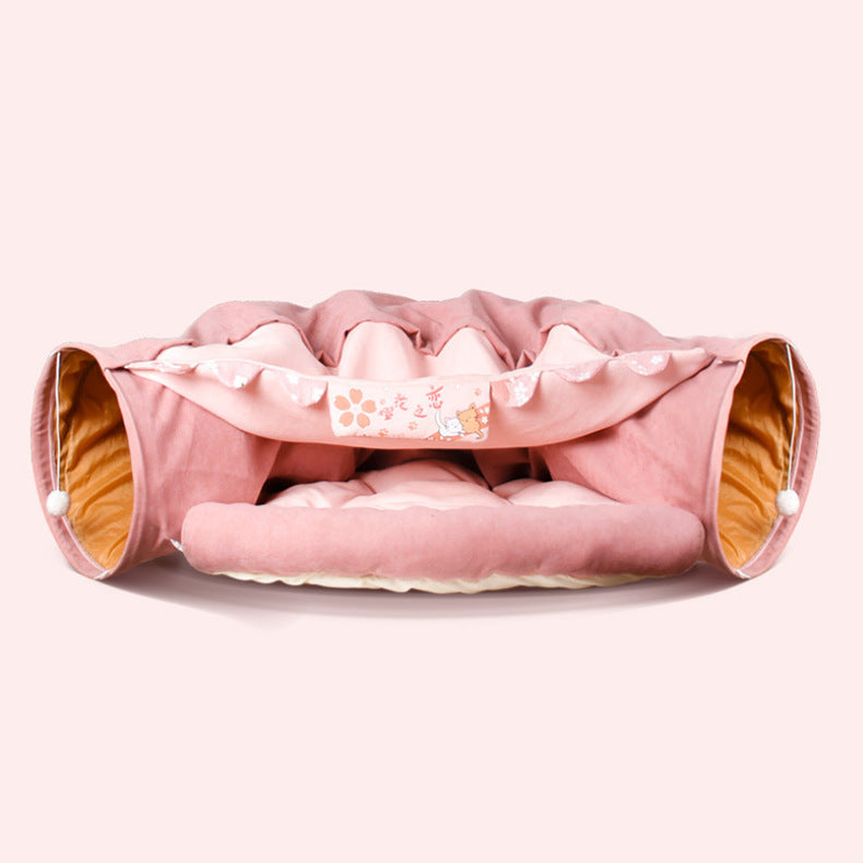Pink collapsible cat tunnel with soft cushioned interior and washable fabric for interactive pet play and comfort