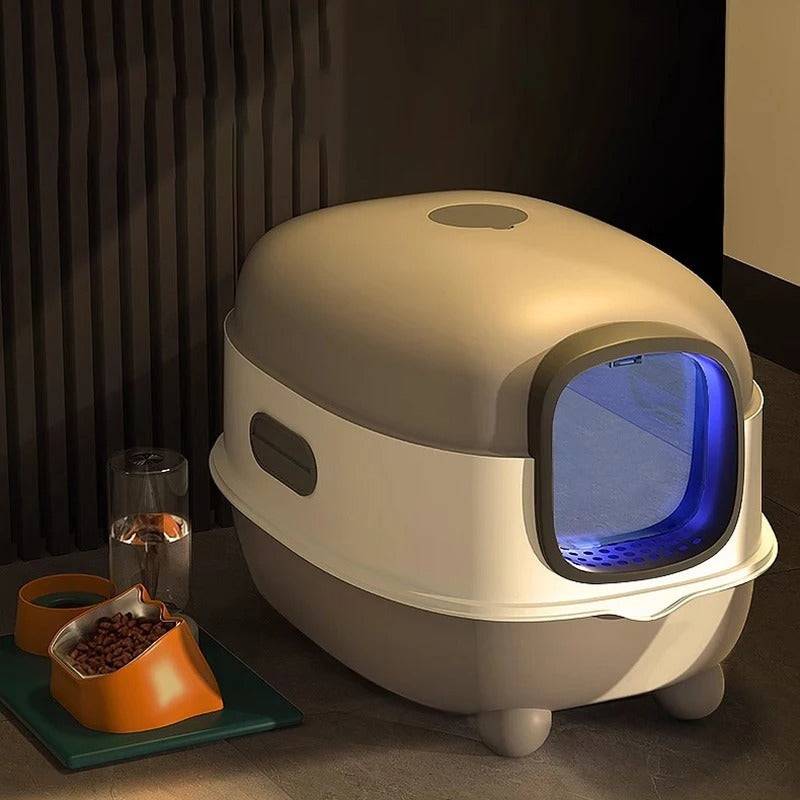 Oversized enclosed cat litter box with blue UV sterilization light, designed for odor control and easy cleaning.