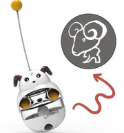 Interactive white and brown dog-shaped tumbler treat toy for cats and dogs with a yellow ball inside and antenna toy topper