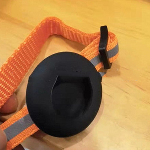 Reflective adjustable orange pet collar with black Airtag holder and bell attachment for cats and small dogs