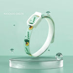 Load image into Gallery viewer, Avocado green flea and tick repellent collar for dogs and cats displayed on clear pedestal with water droplets.
