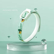Avocado green flea and tick repellent collar for dogs and cats displayed on clear pedestal with water droplets.