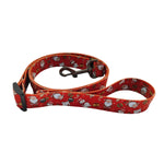 Load image into Gallery viewer, Red Christmas dog leash with festive Santa and snowman pattern, adjustable polyester with metal clip for holiday walks.

