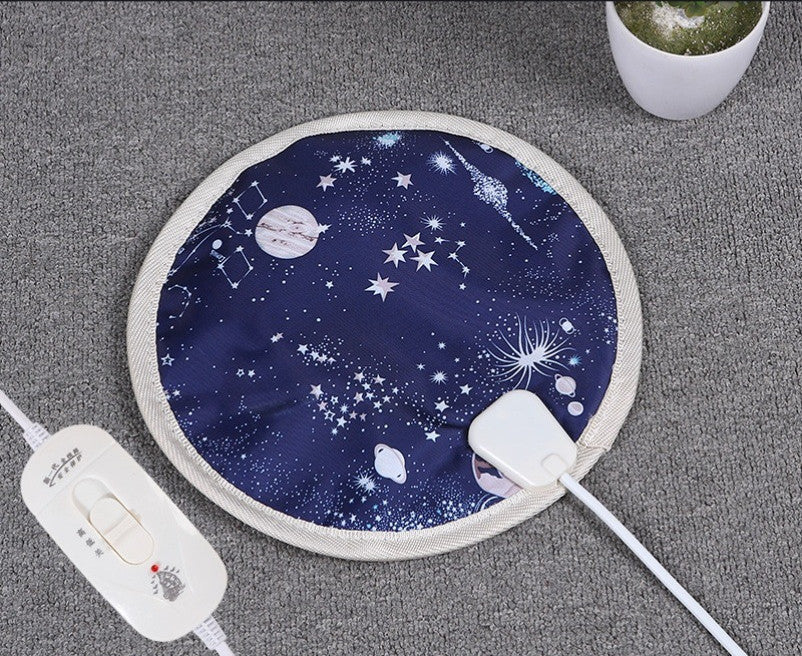 Round electric heating blanket for pets with safe temperature control and space-themed design for kittens and puppies