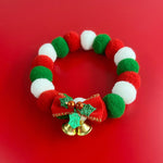 Load image into Gallery viewer, Christmas pet collar with red, green, white plush balls, festive bow, and gold jingle bells for dogs and cats
