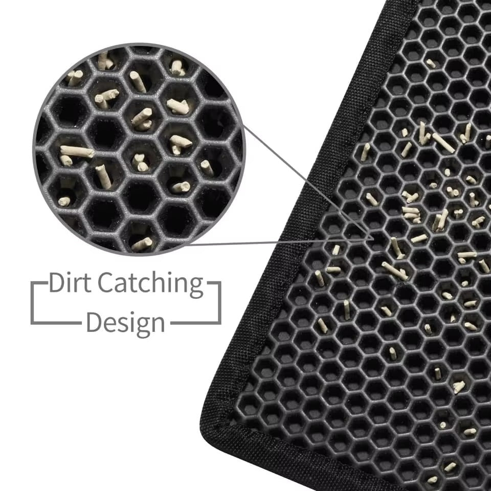 Close-up of a black mat with honeycomb design and dirt-catching features.