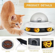 Flying Saucer Pet Slow Feeder with yellow treat balls and dome lid, shown with a curious kitten. Ideal 2-in-1 puzzle toy for smart feeding.