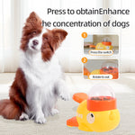 Load image into Gallery viewer, Border collie dog sitting next to a yellow duck-shaped interactive puzzle feeder with instructions to press and rotate buttons.
