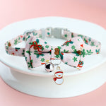 Load image into Gallery viewer, Adjustable Christmas pet collar with festive bow tie, holiday prints, jingle bell, and snowman charm for dogs and cats
