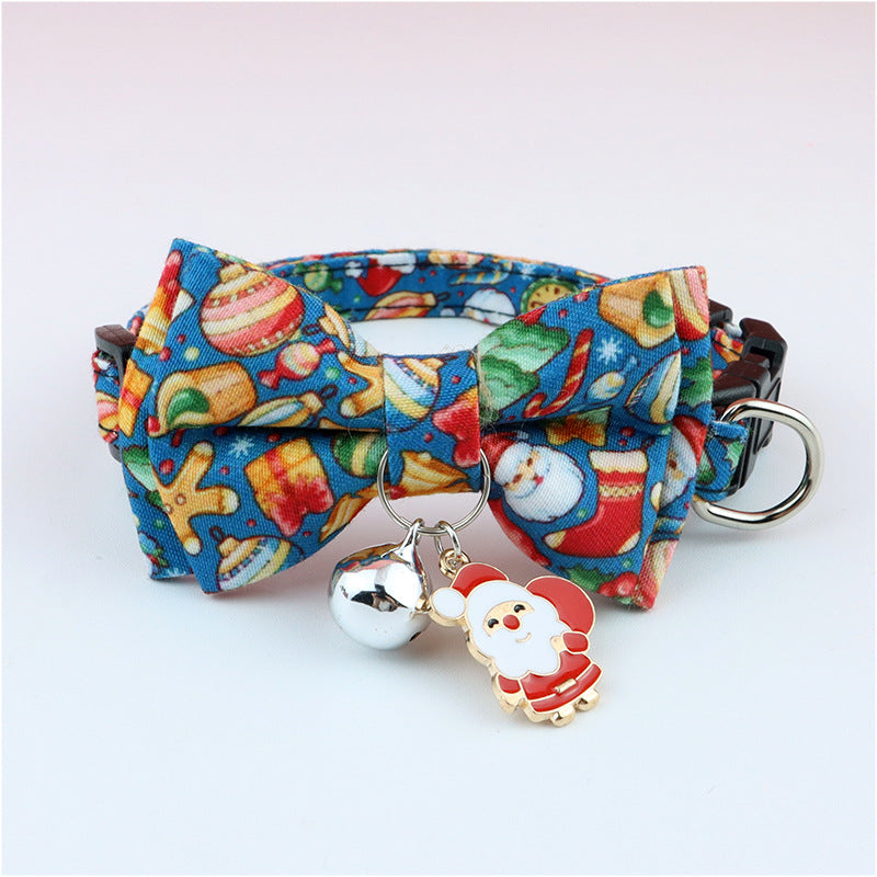 Adjustable blue Christmas pet collar with festive bow tie, silver bell, and Santa Claus charm for dogs and cats