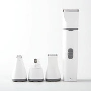 4-in-1 electric pet clipper with interchangeable heads for grooming hair, nails, and paws, sleek white design.