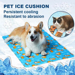 Load image into Gallery viewer, Dog lying on blue cooling gel mat with cartoon pattern, designed for persistent cooling and abrasion resistance.
